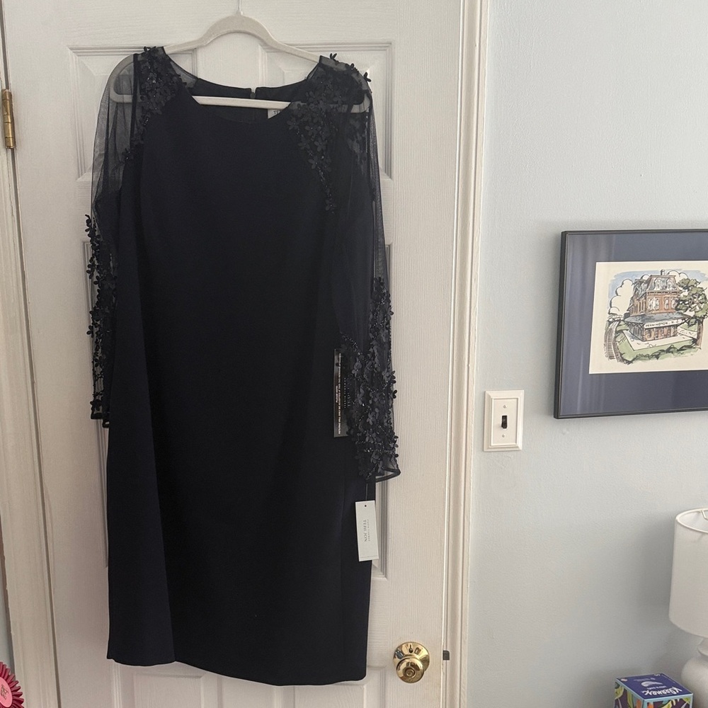 Elegant navy dress with mesh floral appliqué sleeves